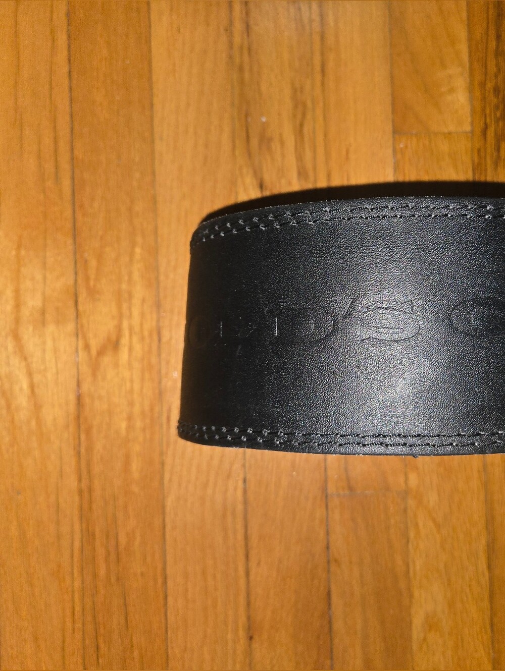 Black Leather Weightlifting Belt with Subtle Embossed Logo